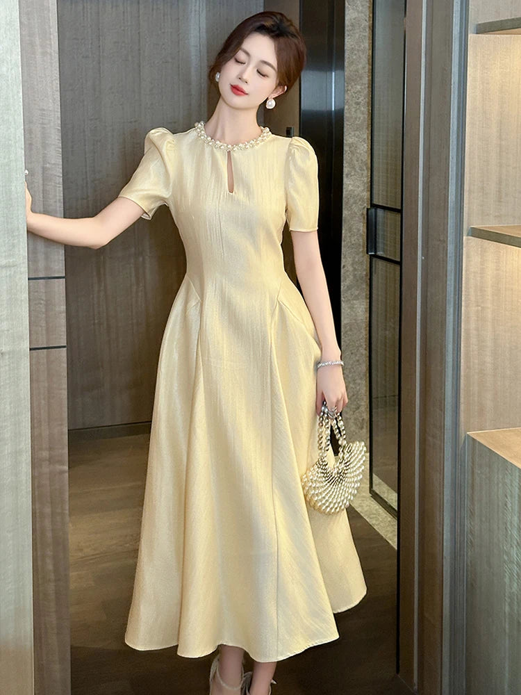 Gold Midi Dress with Pearl Neckline Accent Gold Midi Dress With Pearl Neckline Accent on Luulla